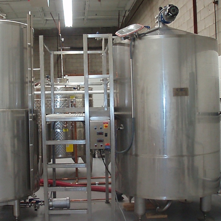 Stainless steel production tanks inside the Premium Bottlers facility